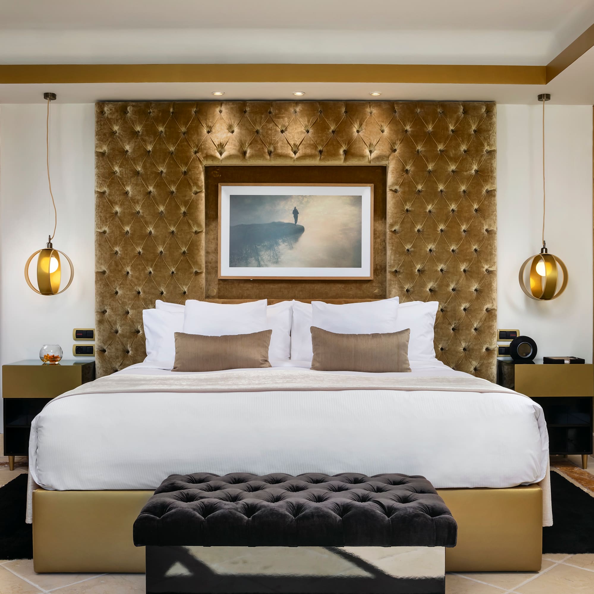 a bed with a picture above it