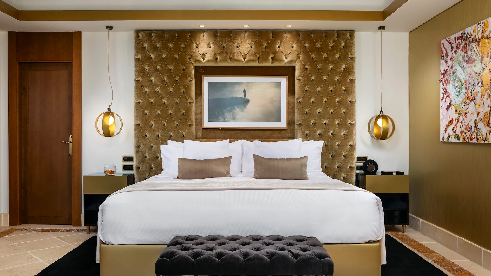 a bed with a picture above it