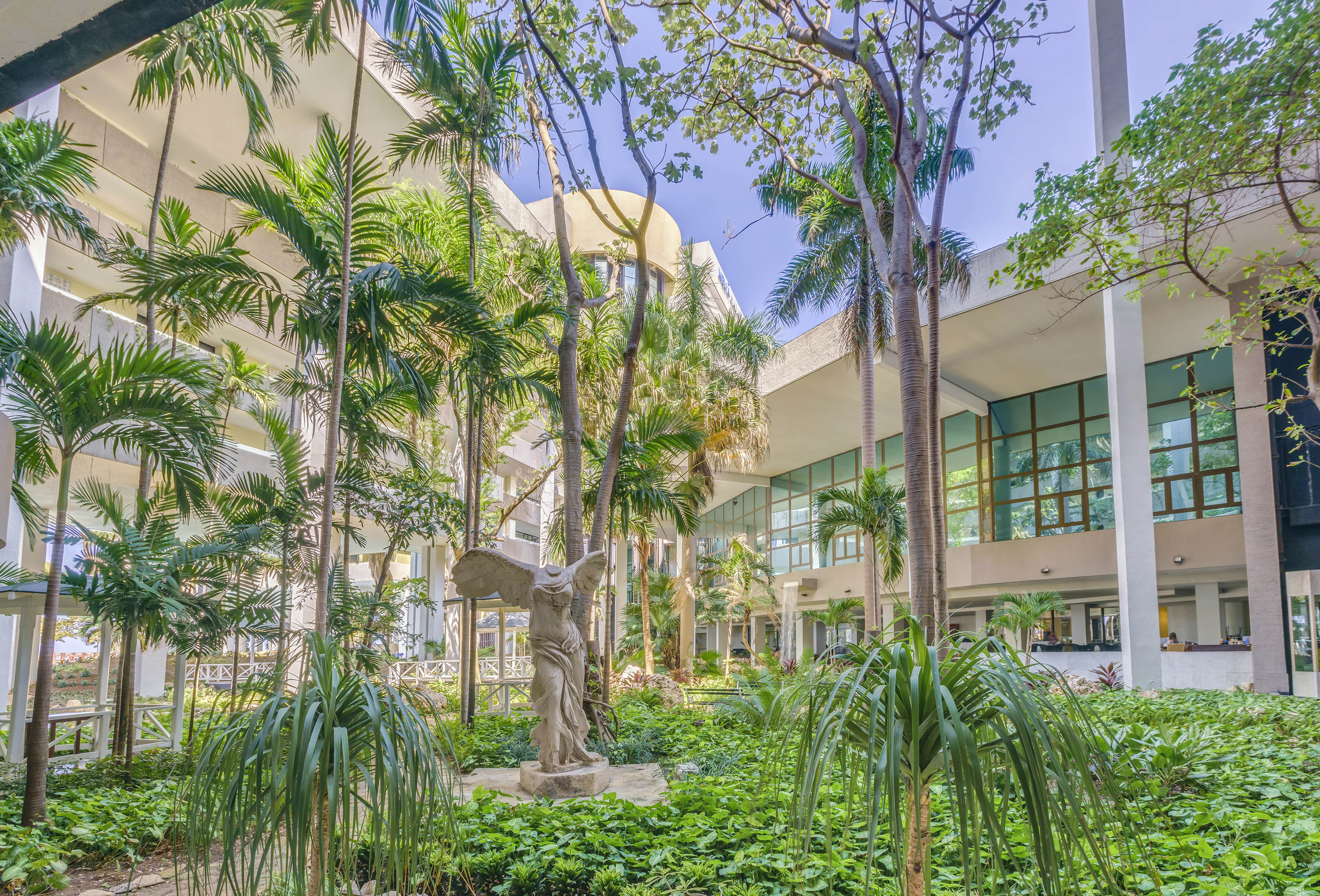 a statue in a courtyard of a building