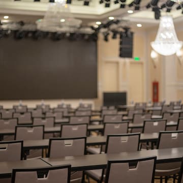 a room with chairs and a stage
