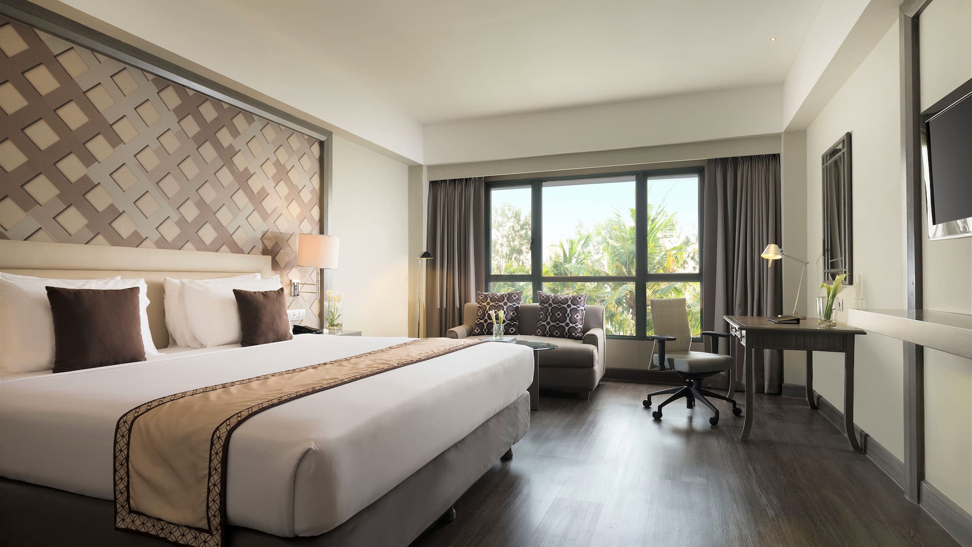 a room with a bed and a desk