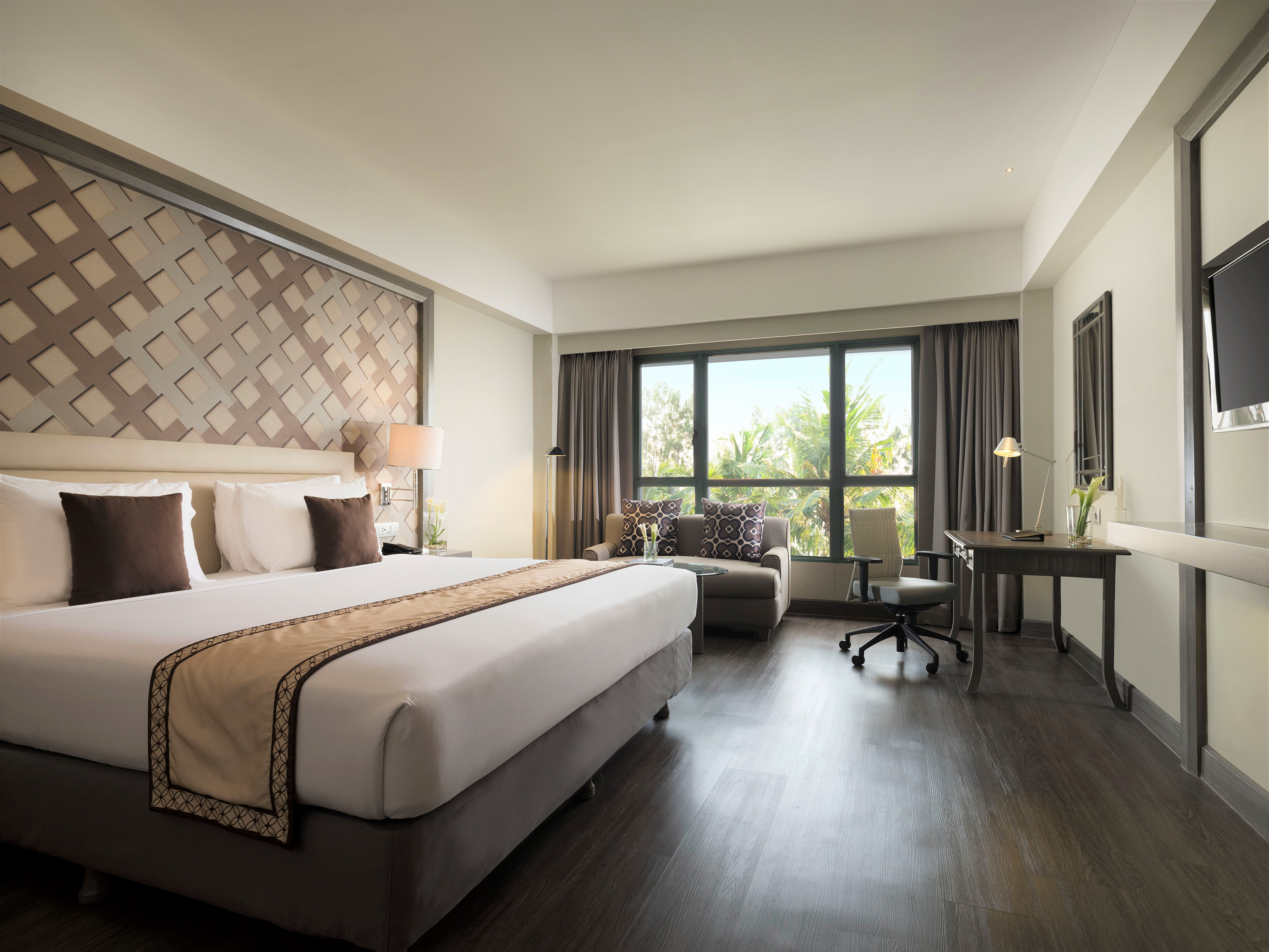 a room with a bed and a desk