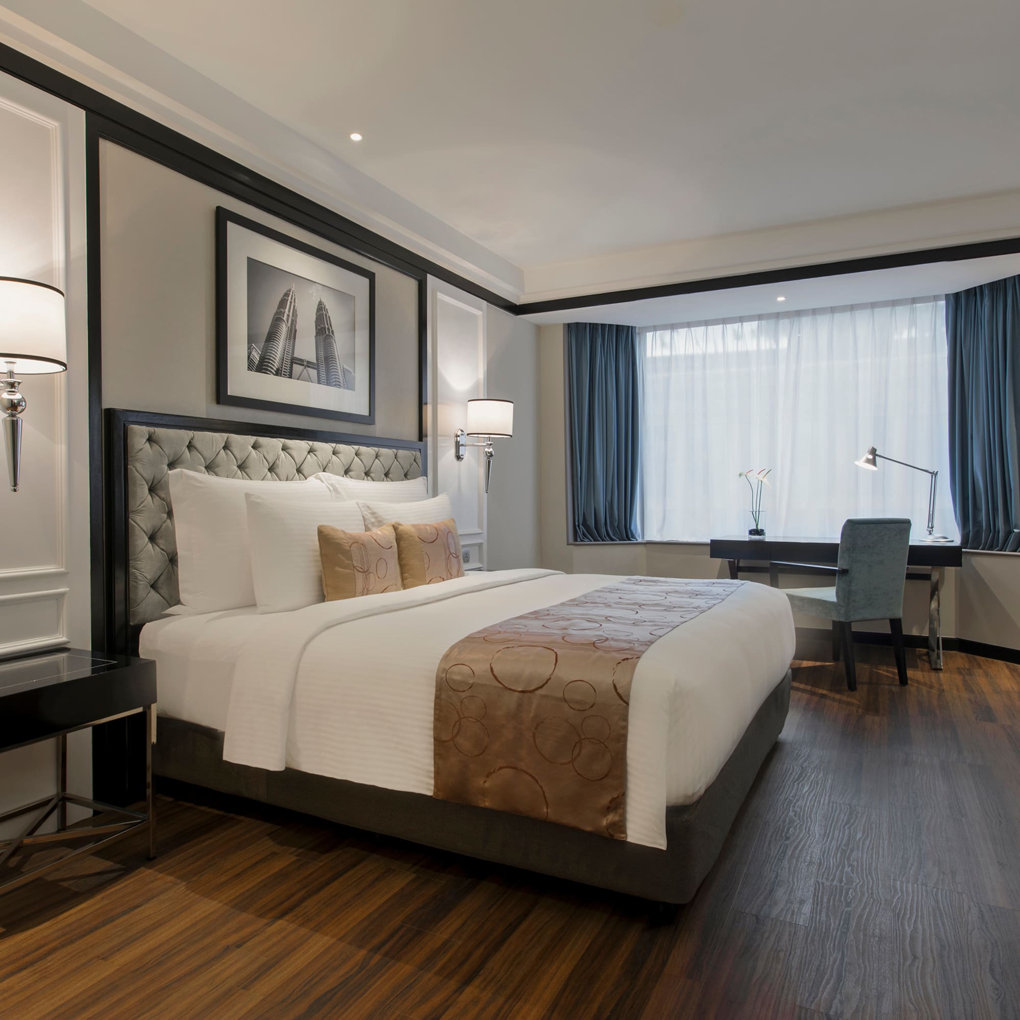 a bedroom with a desk and lamp