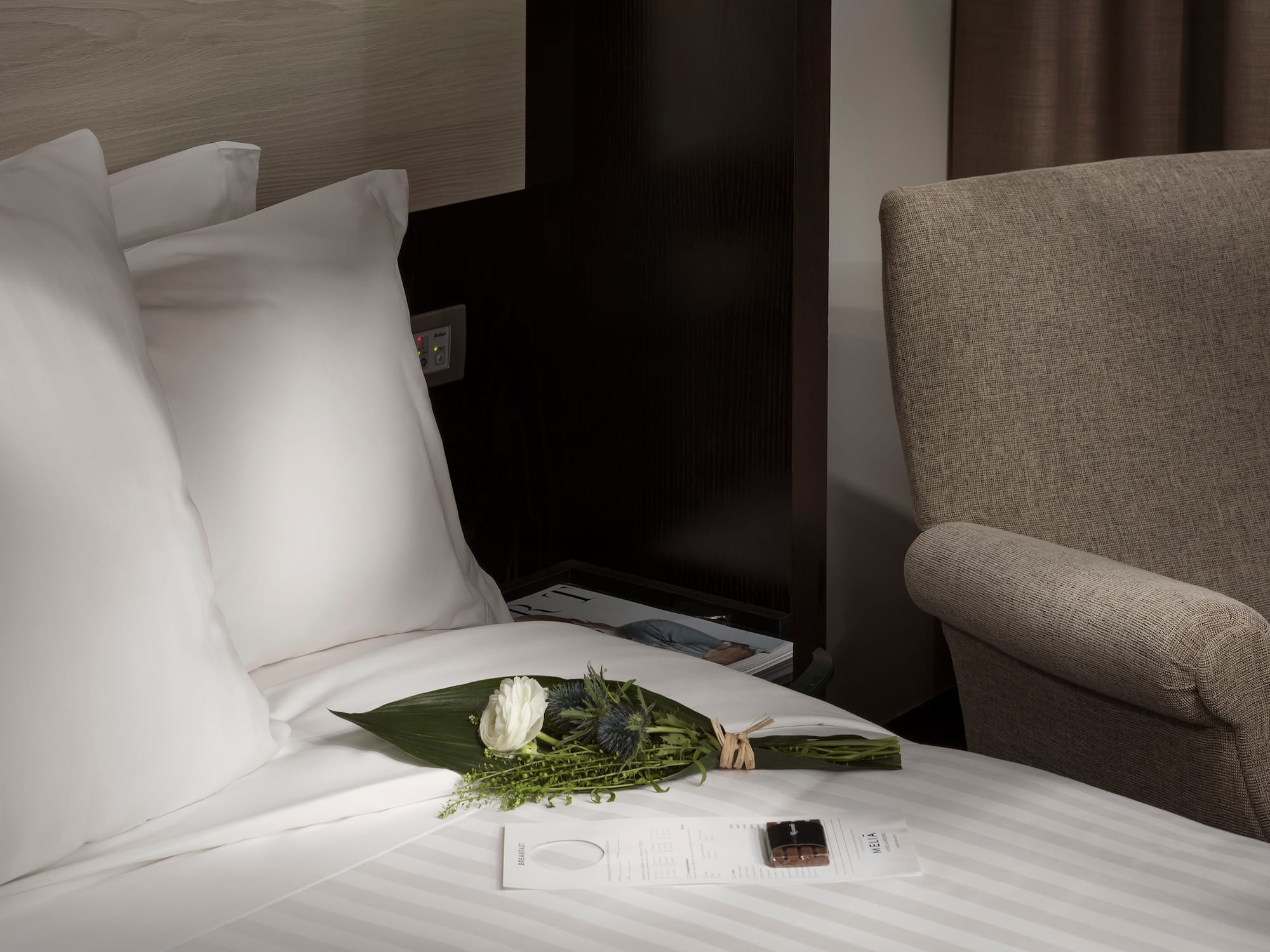 a bouquet of flowers on a bed