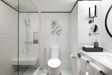 a bathroom with a toilet and shower