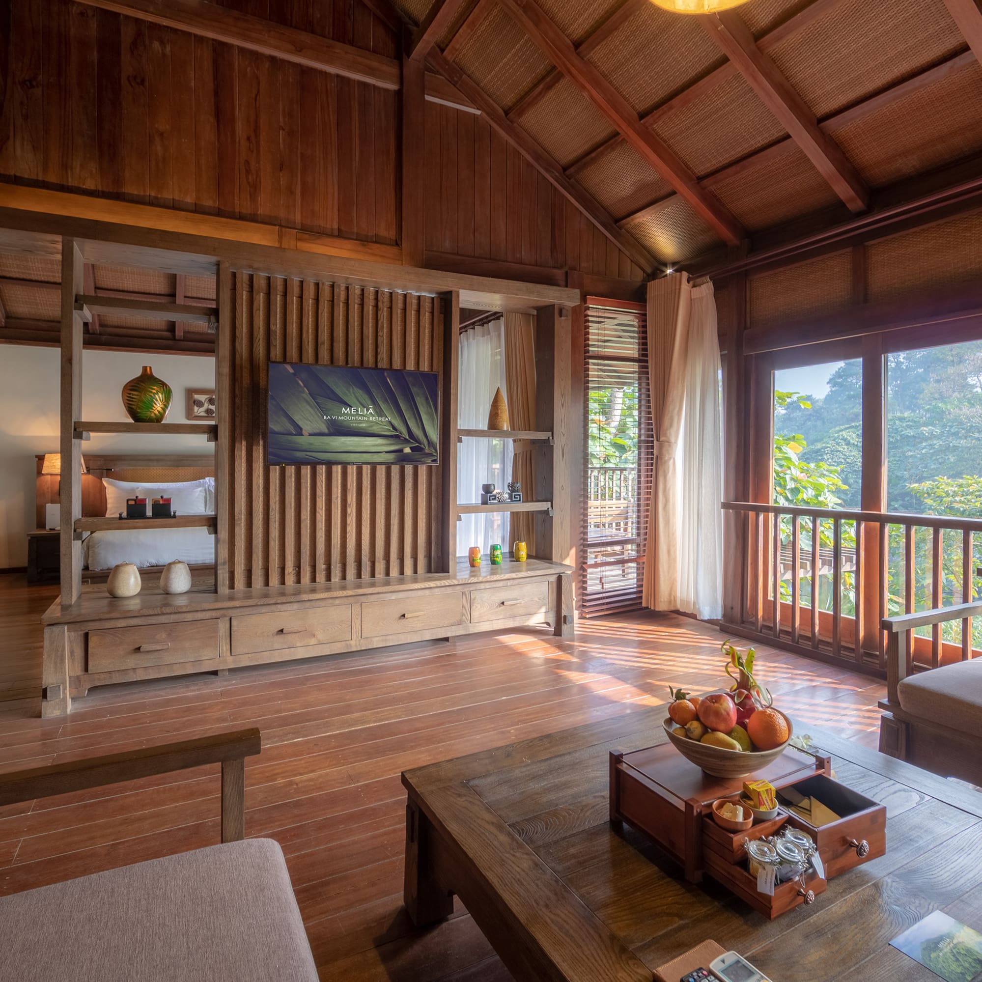 a room with a television and a wood floor