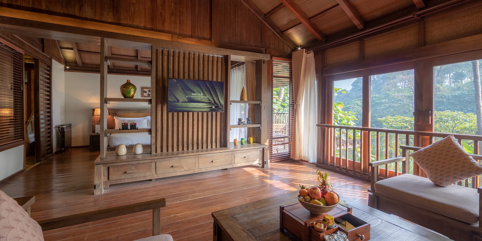 a room with a television and a wood floor