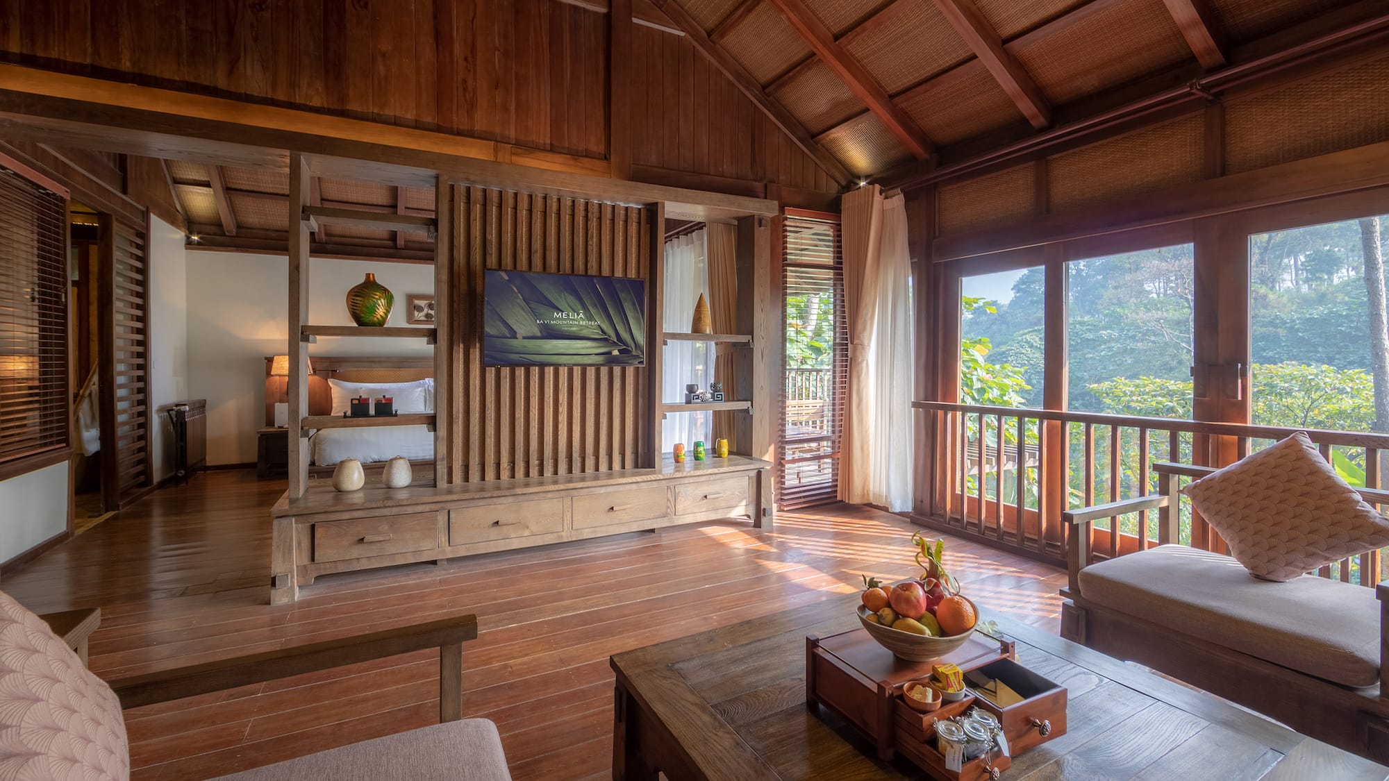 a room with a television and a wood floor