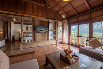 a room with a television and a wood floor