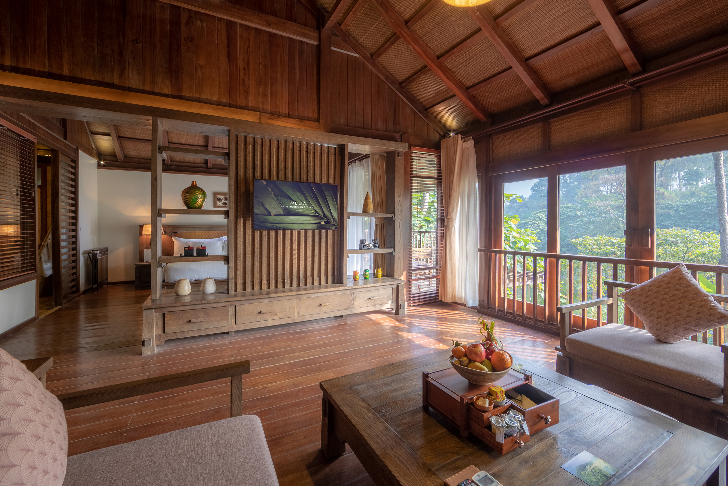 a room with a television and a wood floor