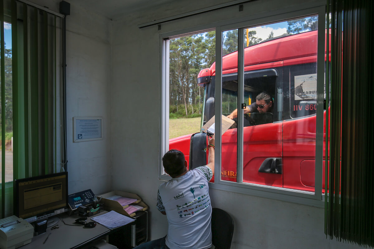 a man holding a box in a window