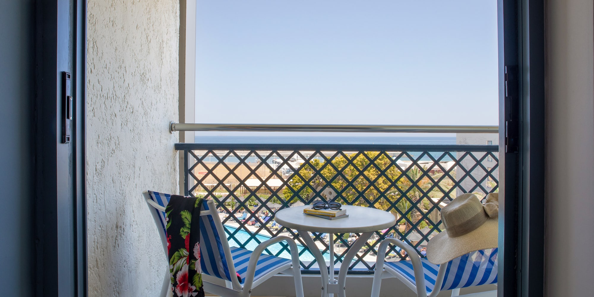 a chair and table on a balcony