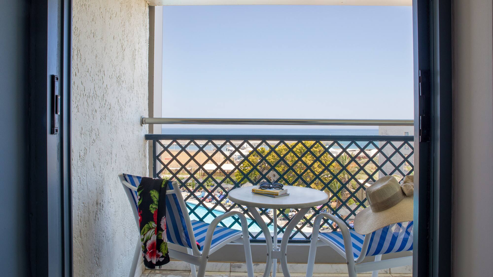 a chair and table on a balcony