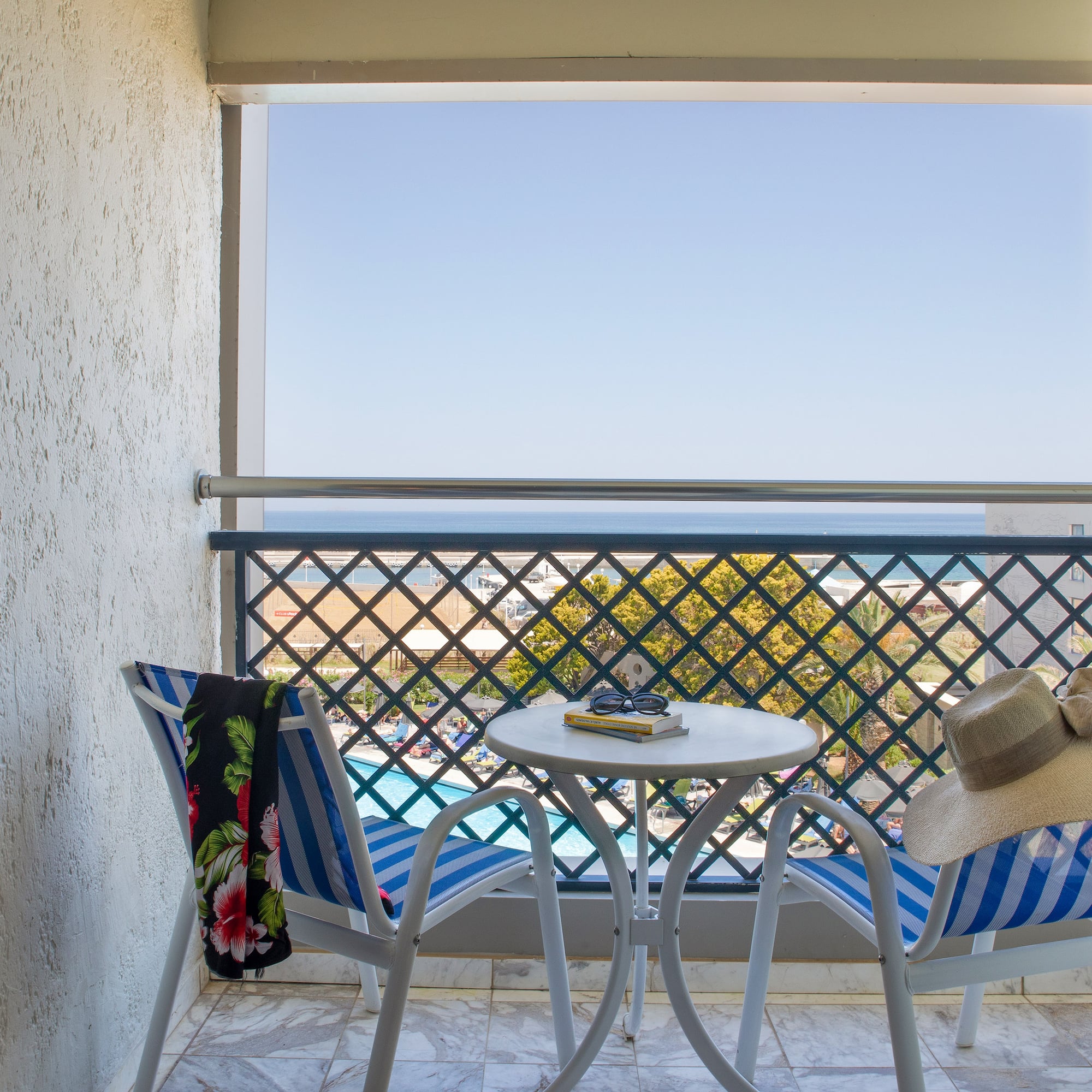 a chair and table on a balcony
