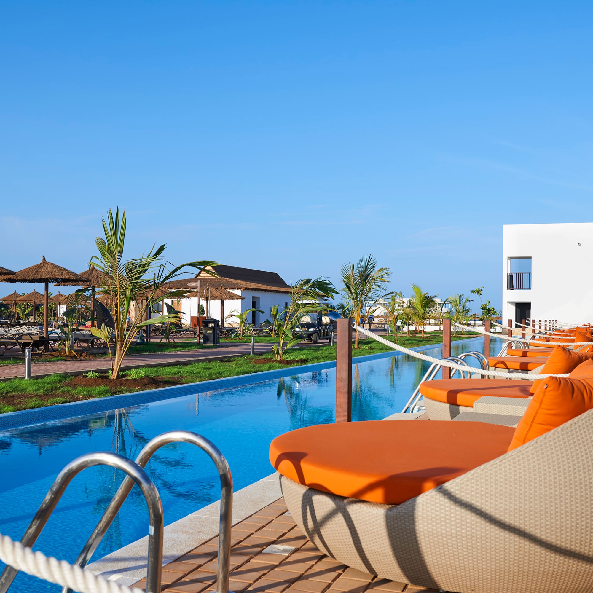 a pool with chairs and a rope around it