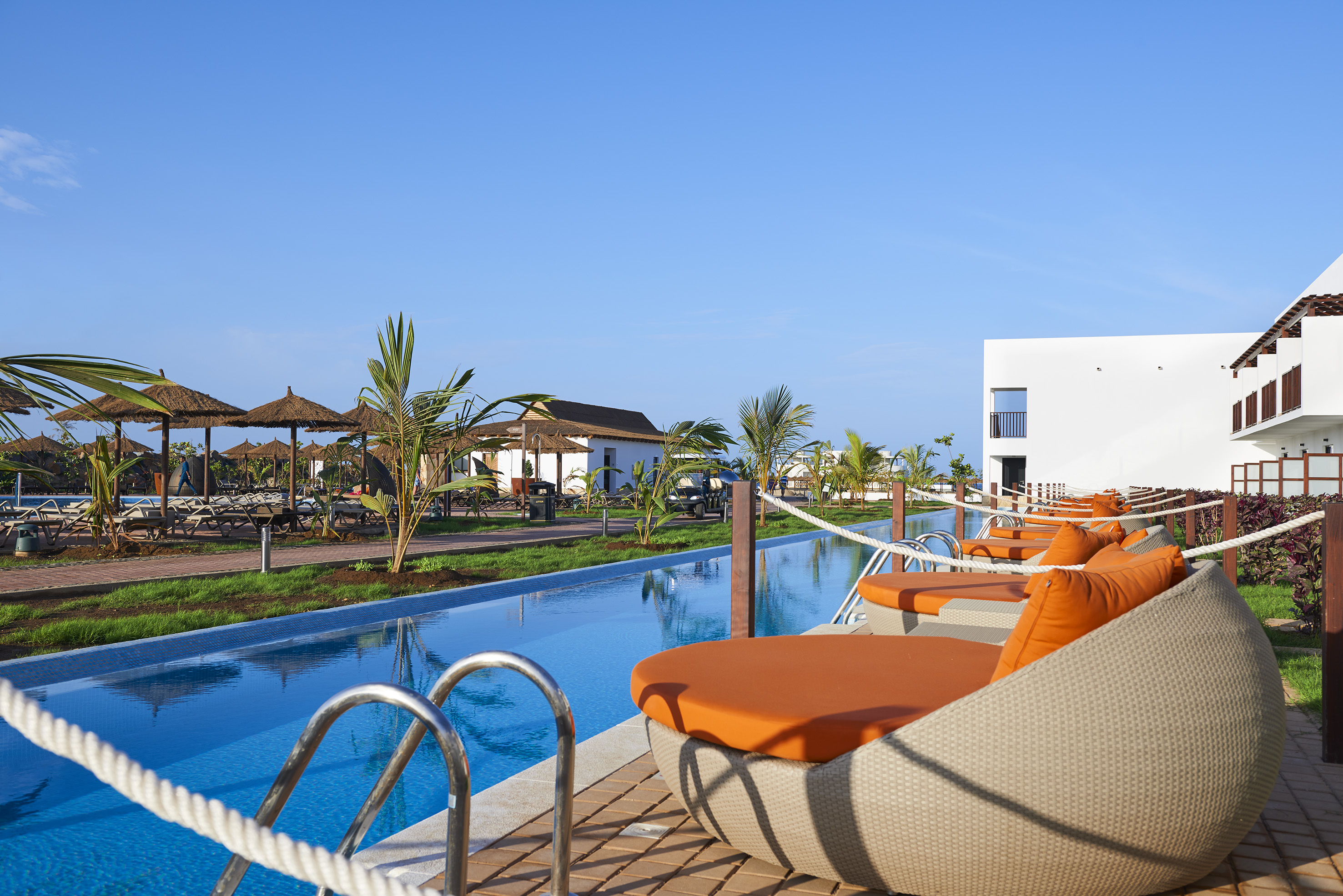 a pool with chairs and a rope around it