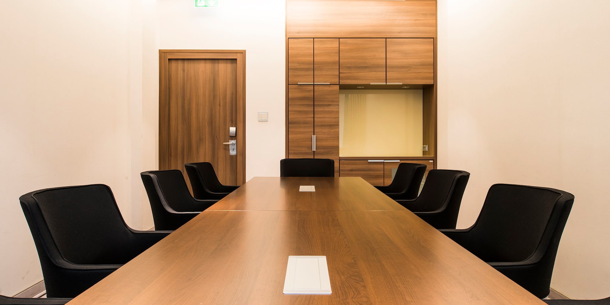 a conference room with a table and chairs