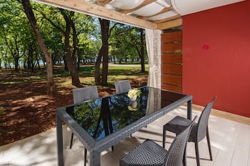 a table and chairs on a deck
