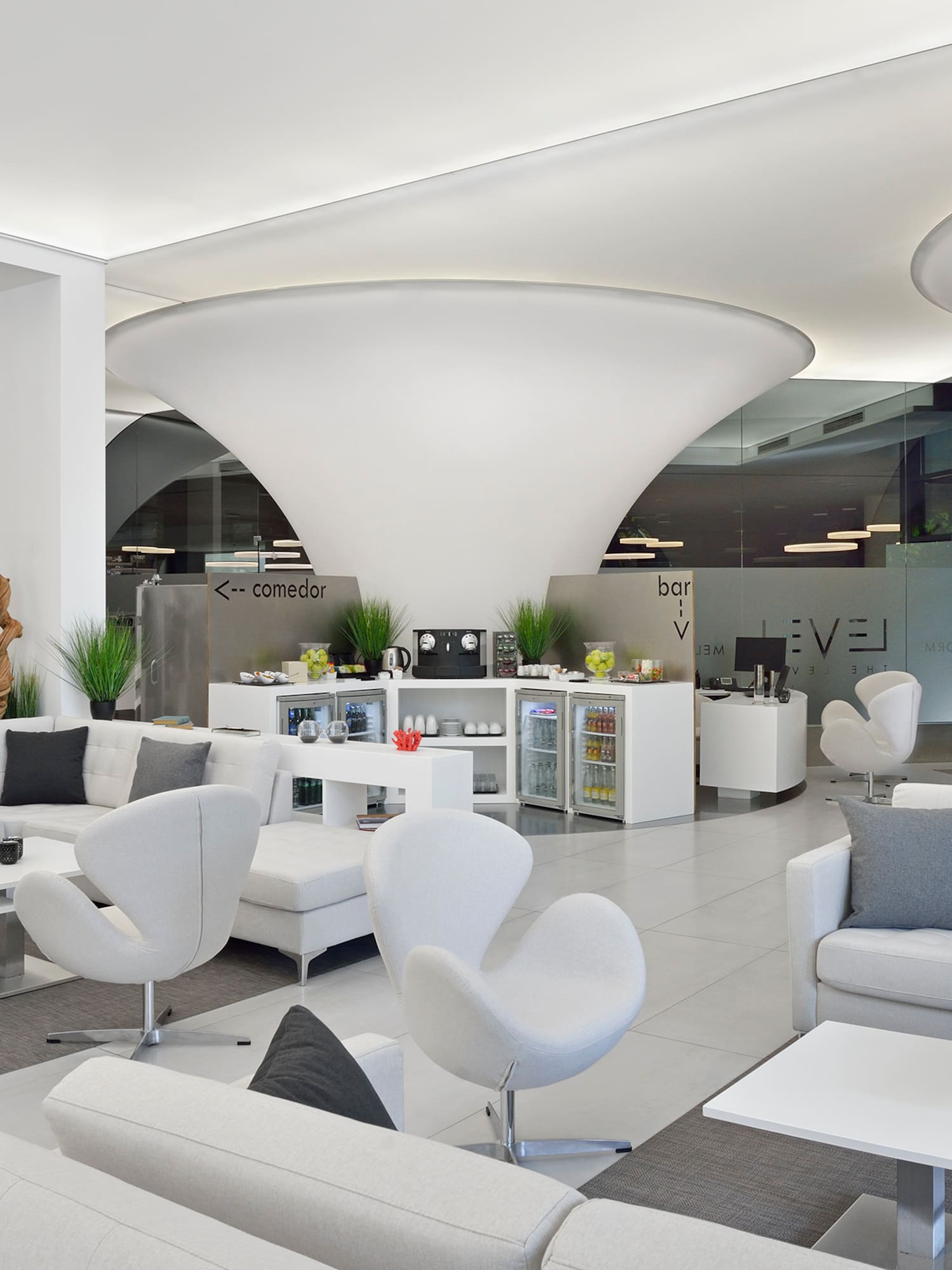 a white and grey room with white furniture