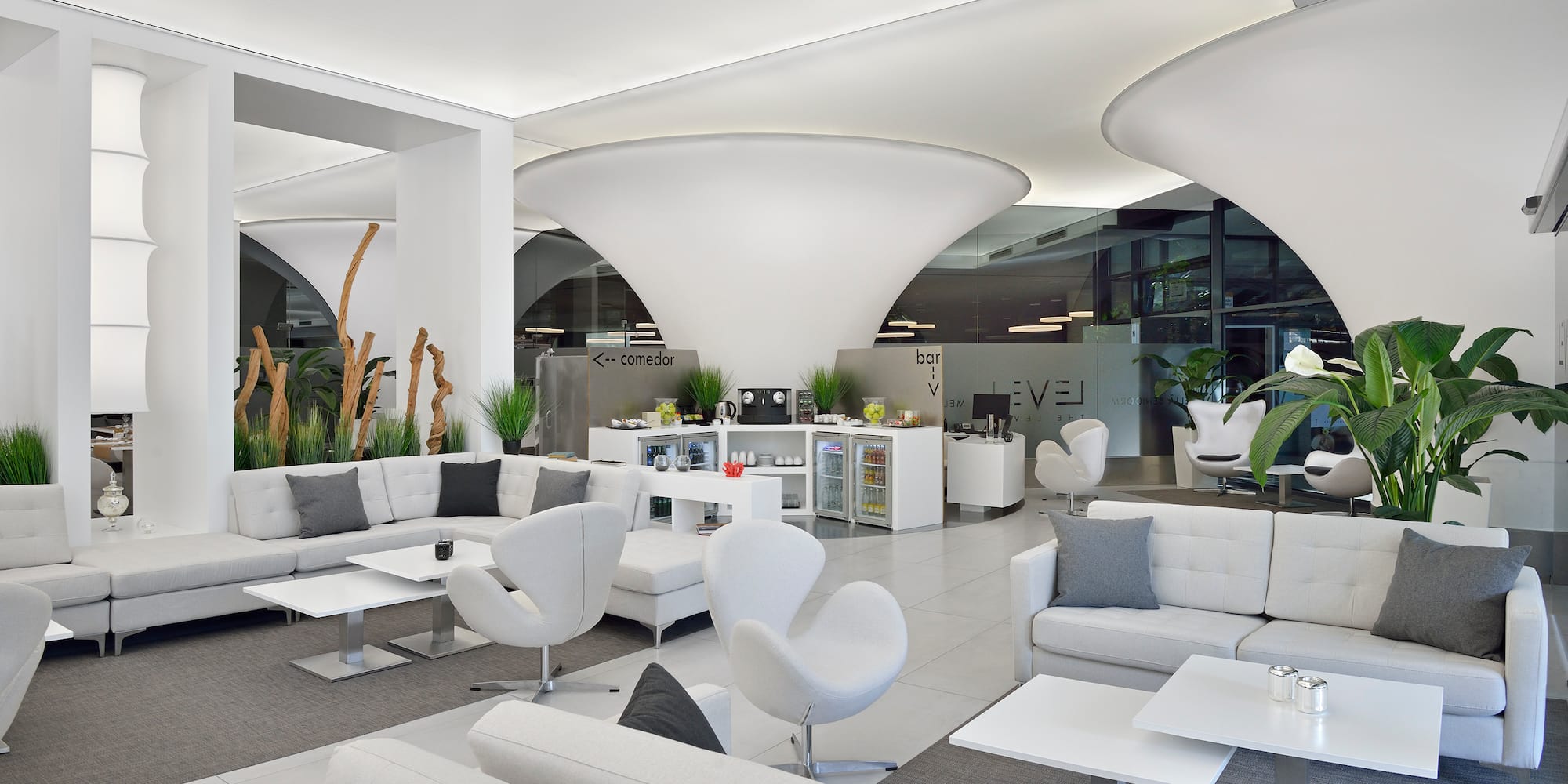 a white and grey room with white furniture