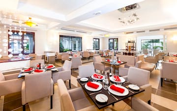 a restaurant with tables and chairs