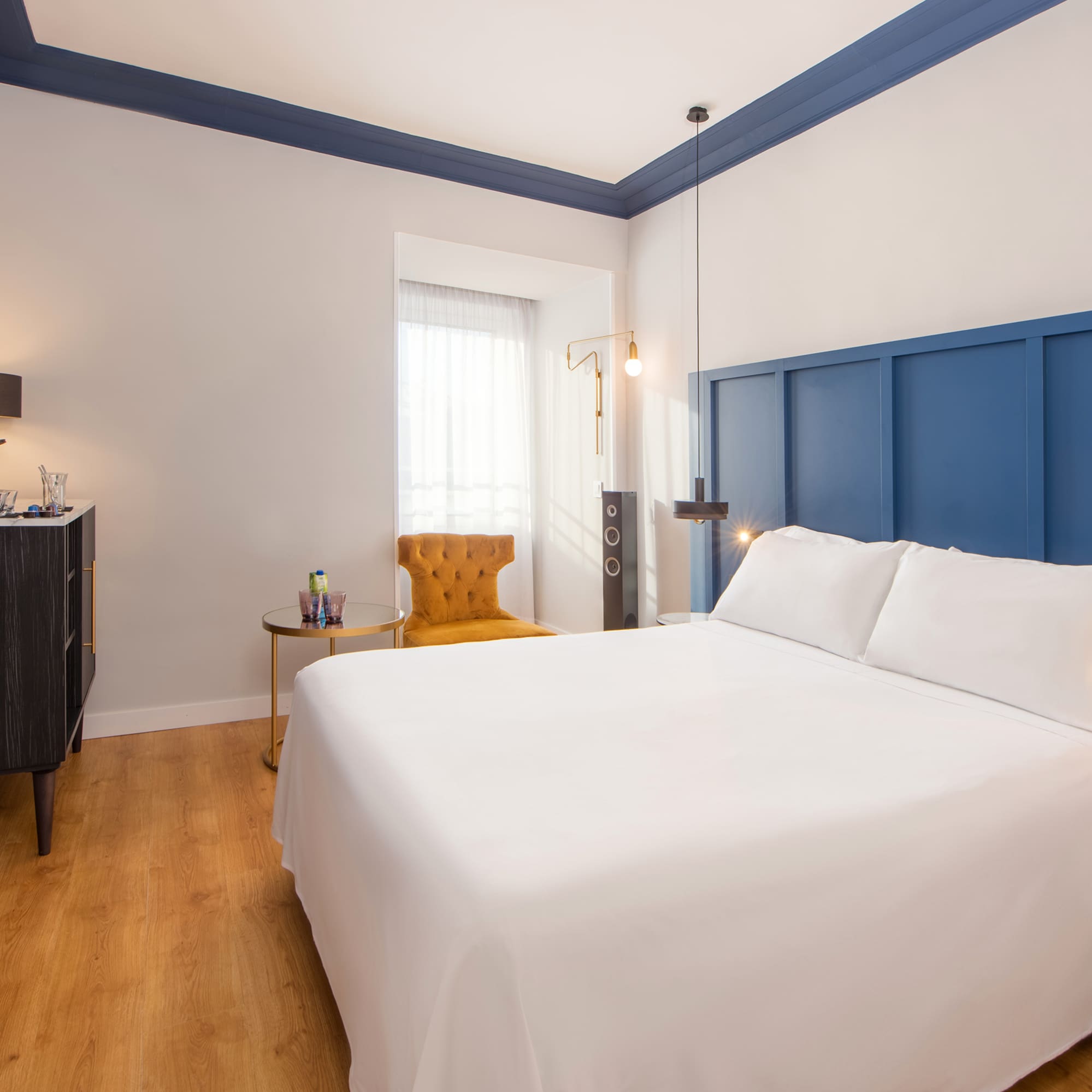 a room with a bed and a chair