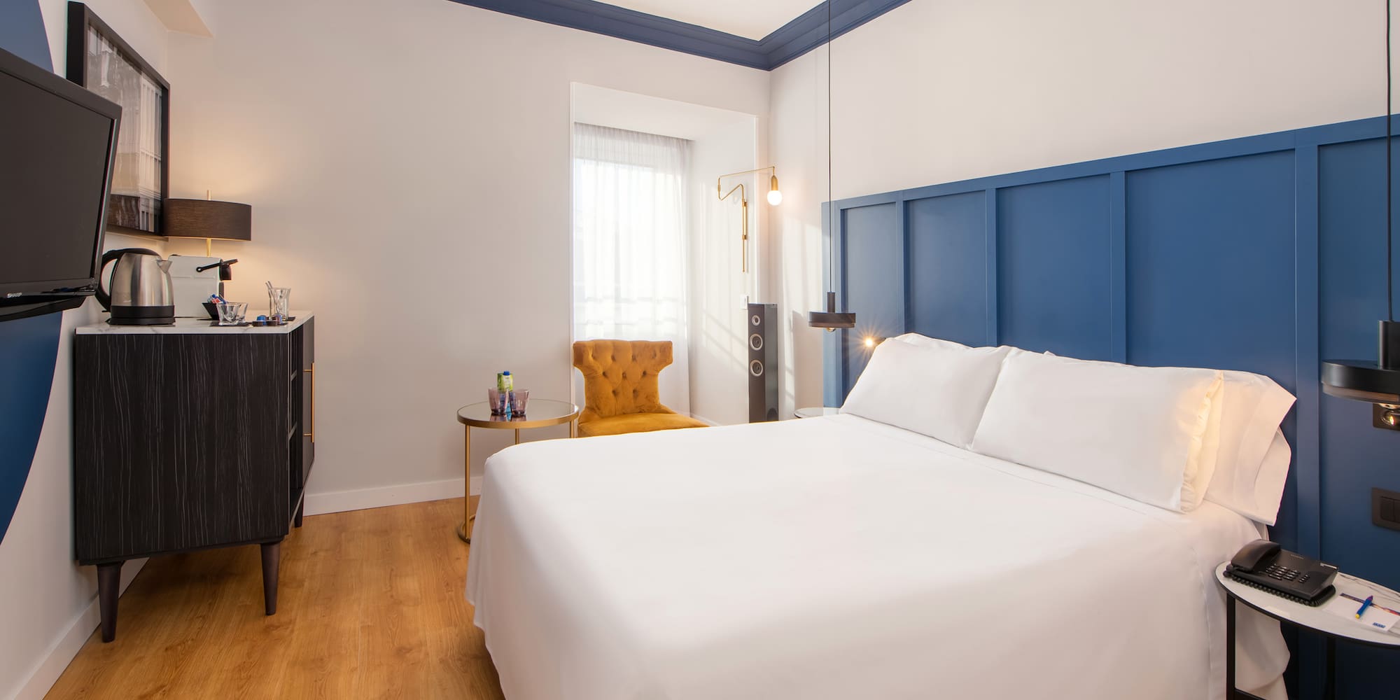 a room with a bed and a chair