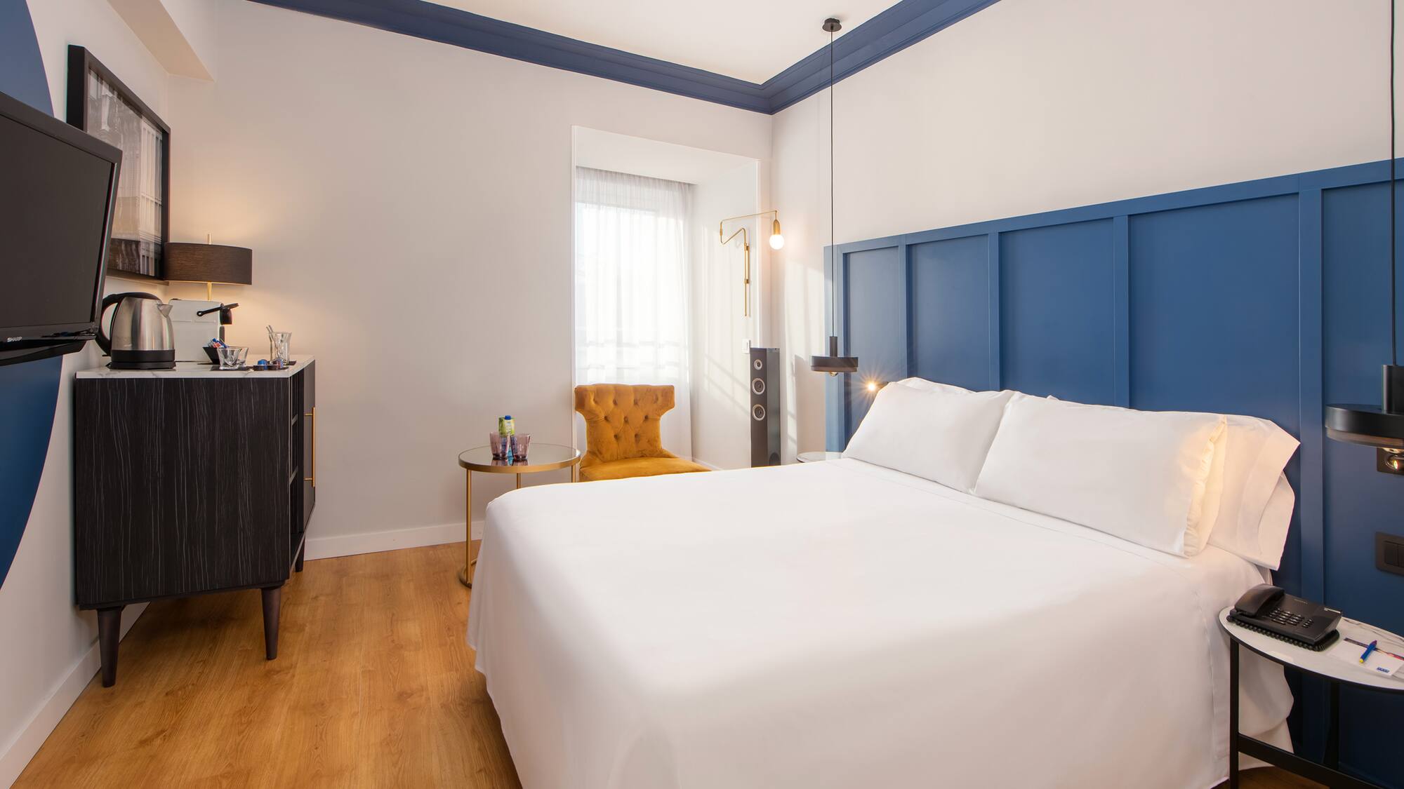 a room with a bed and a chair