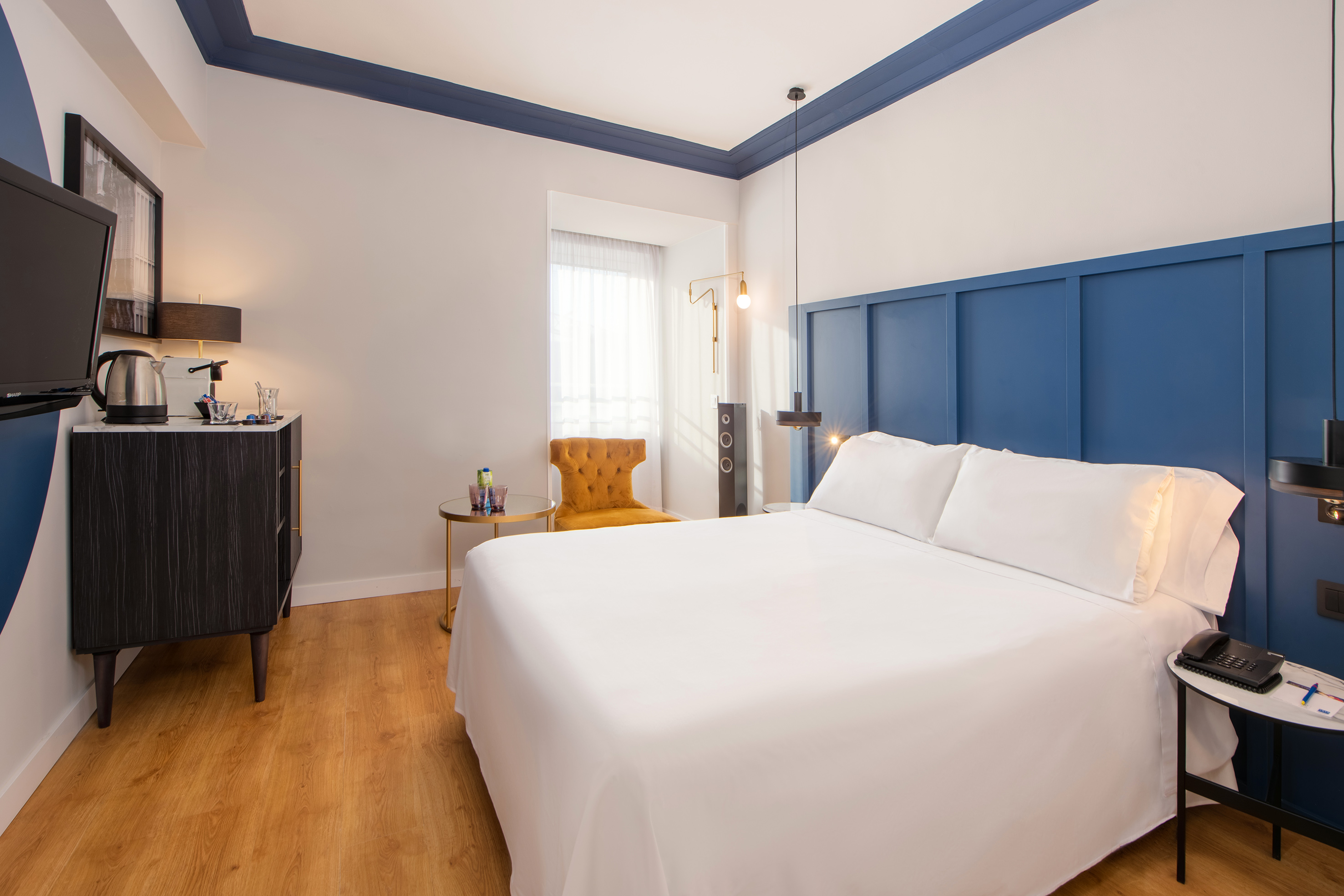 a room with a bed and a chair