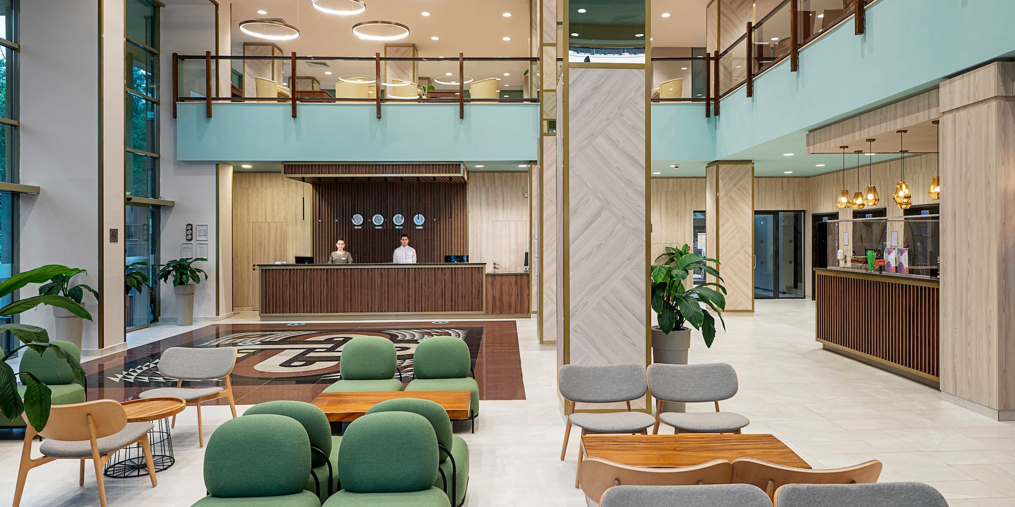 a lobby with a reception desk and chairs