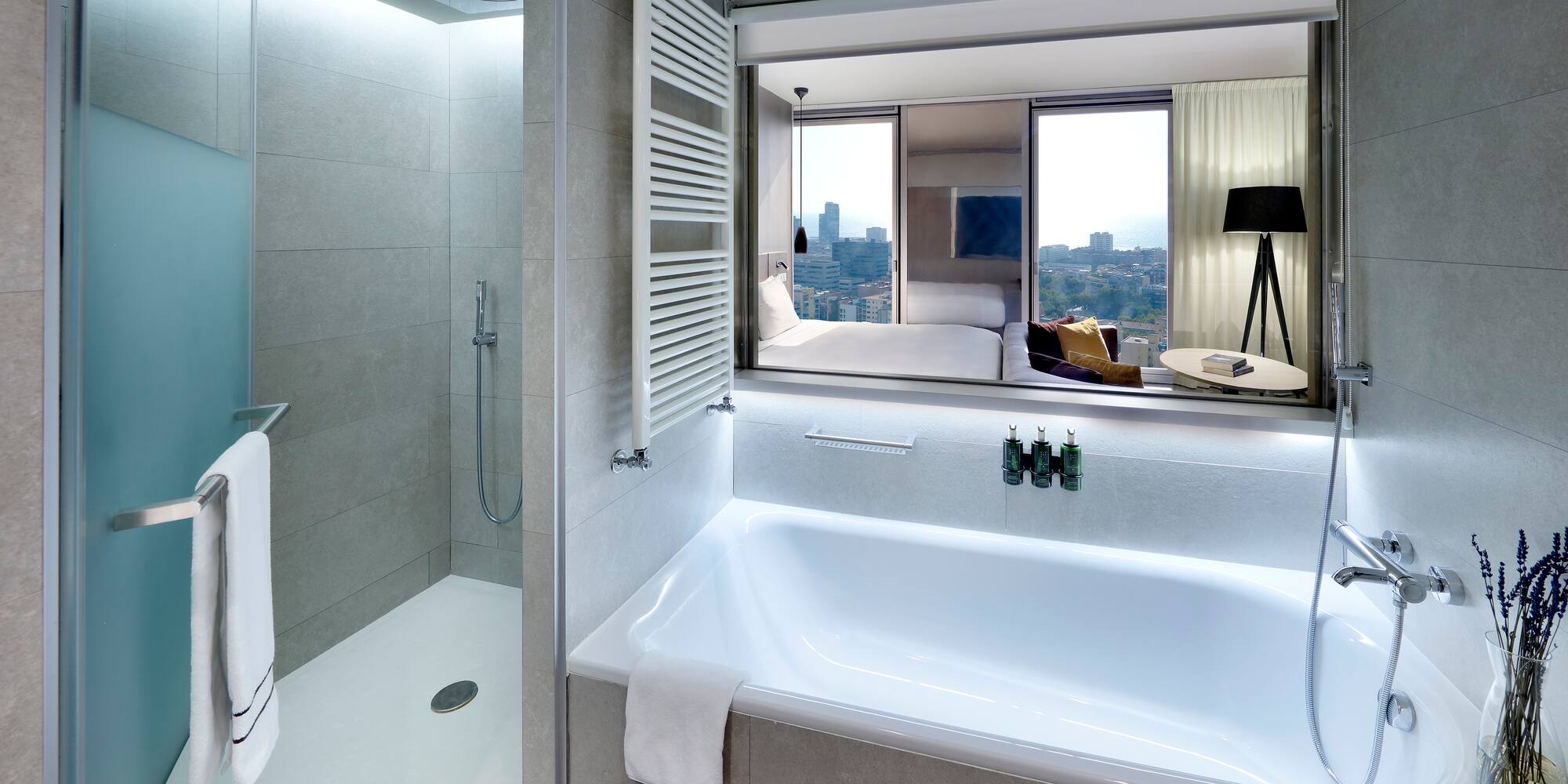 a bathroom with a bathtub and a shower