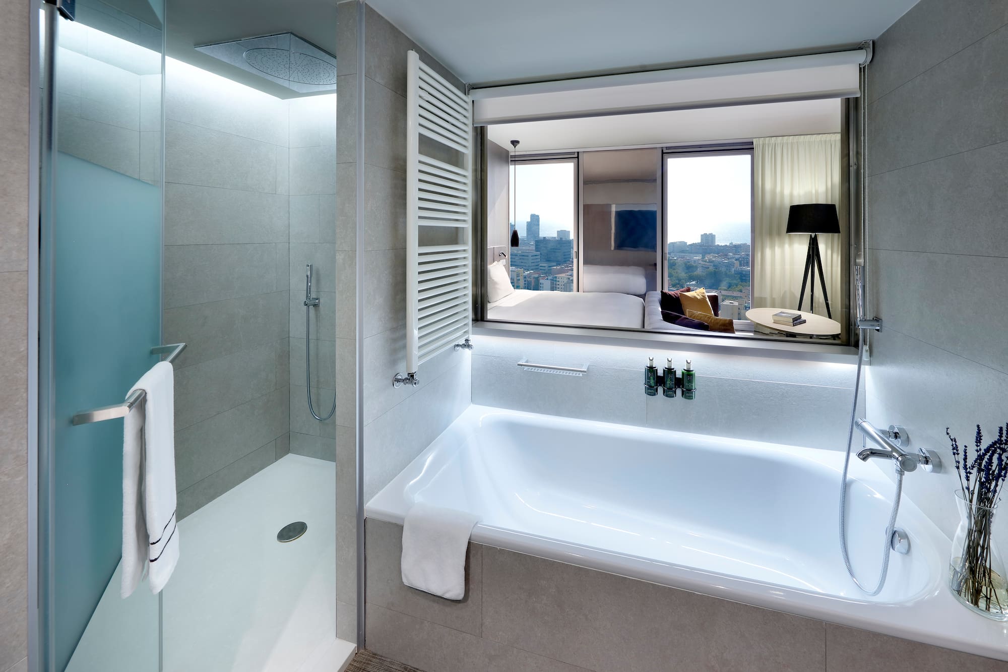 a bathroom with a bathtub and a shower