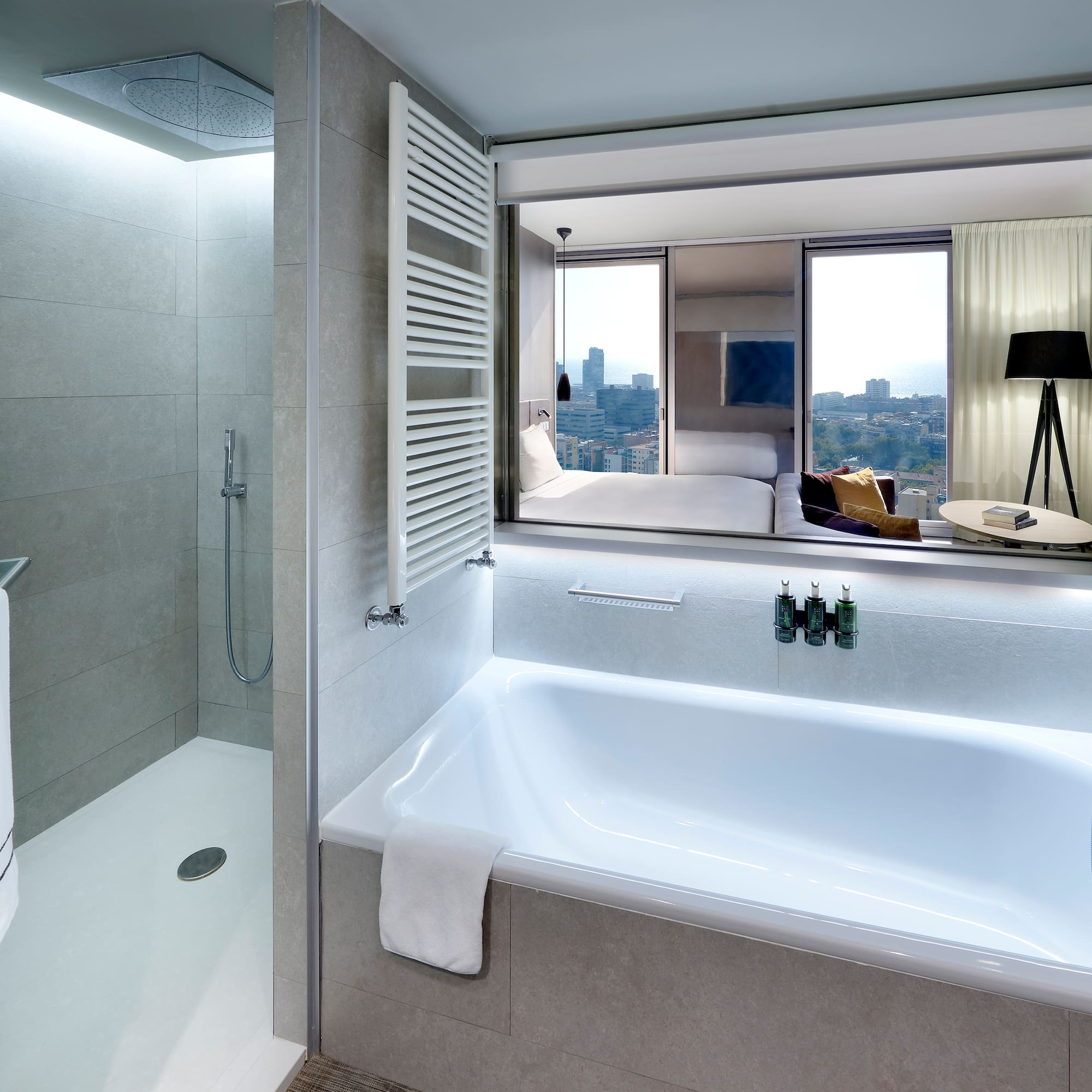 a bathroom with a bathtub and a shower