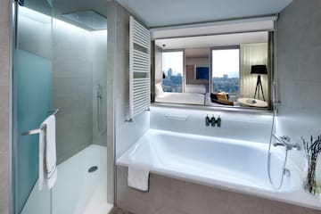 a bathroom with a bathtub and a shower