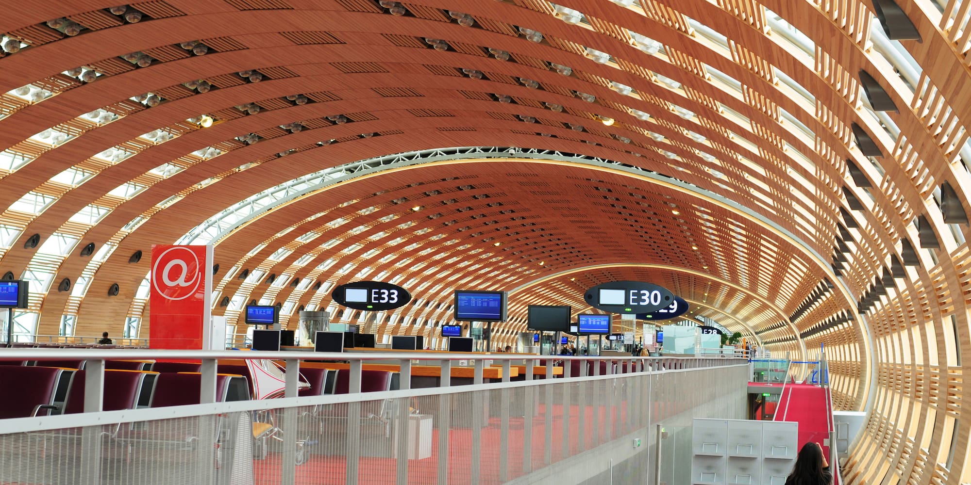a woman walking in a tunnel