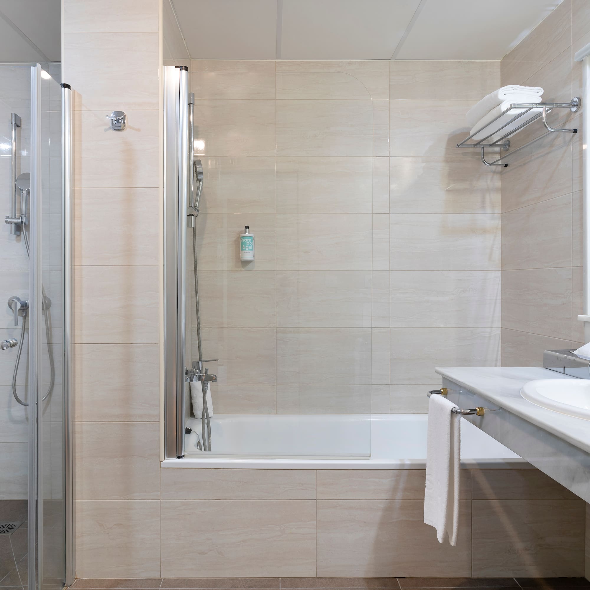 a bathroom with a shower and sink