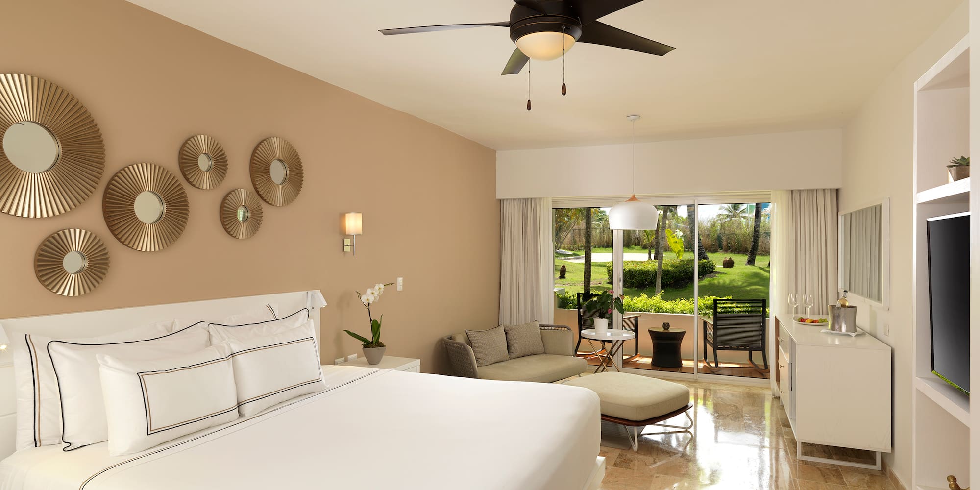 a room with a bed and a ceiling fan