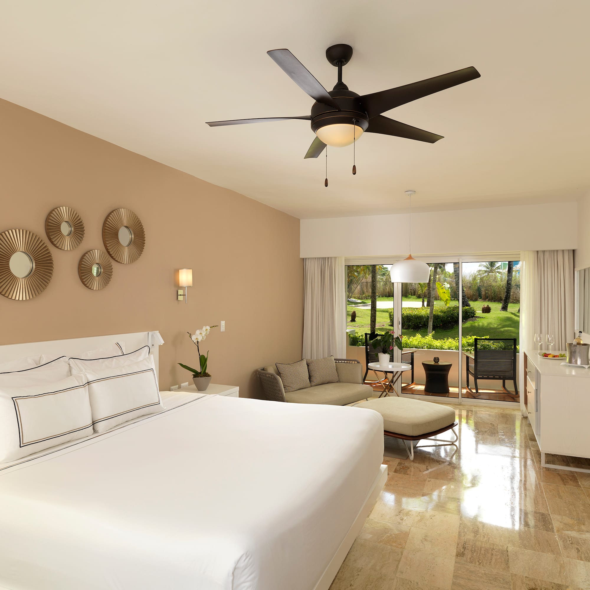 a room with a bed and a ceiling fan