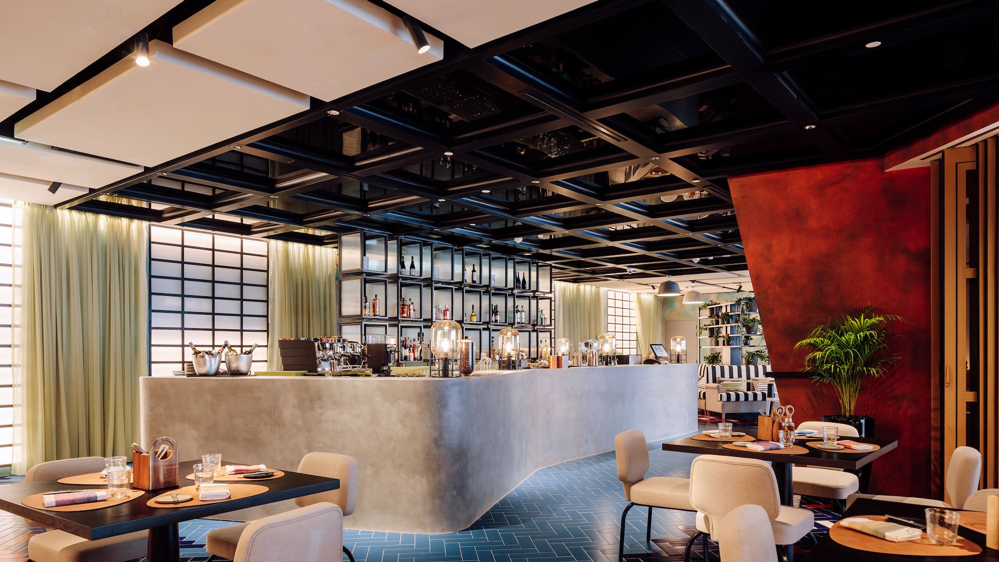 a restaurant with tables and chairs