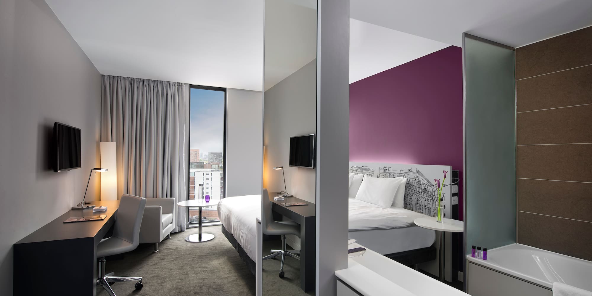 a room with a bed and a desk