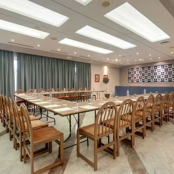 a room with a long table and chairs