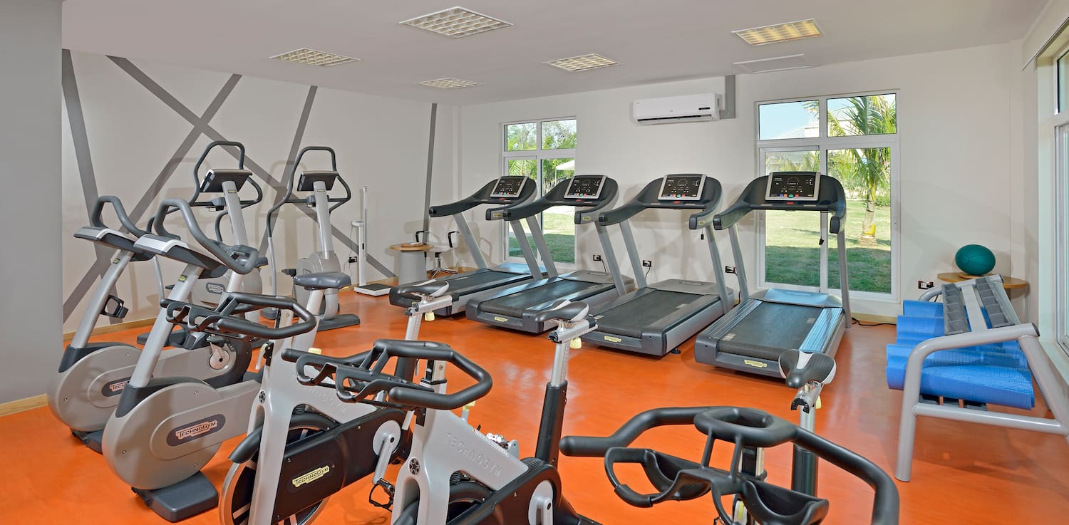 a room with treadmills and exercise machines