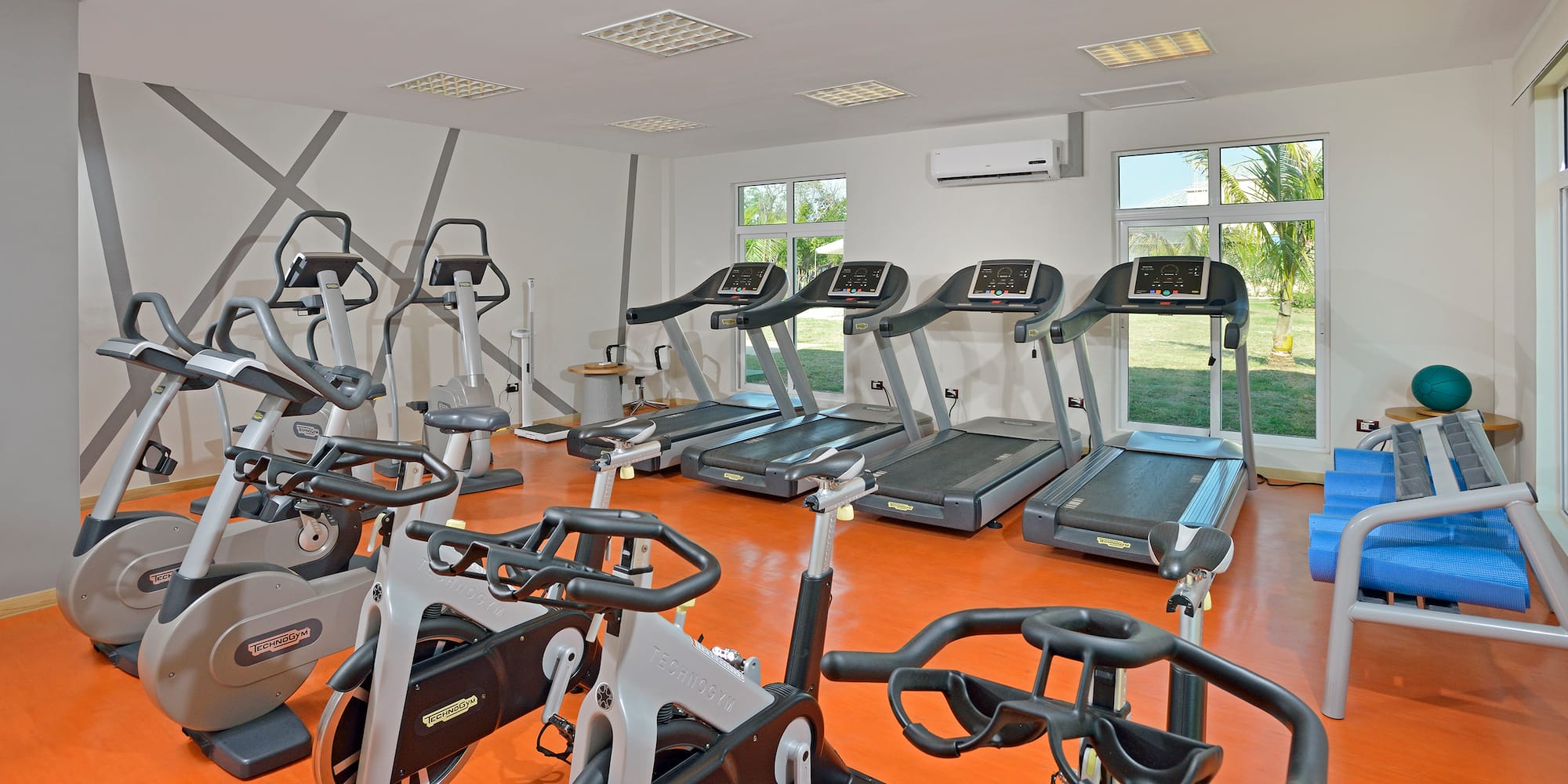 a room with treadmills and exercise machines
