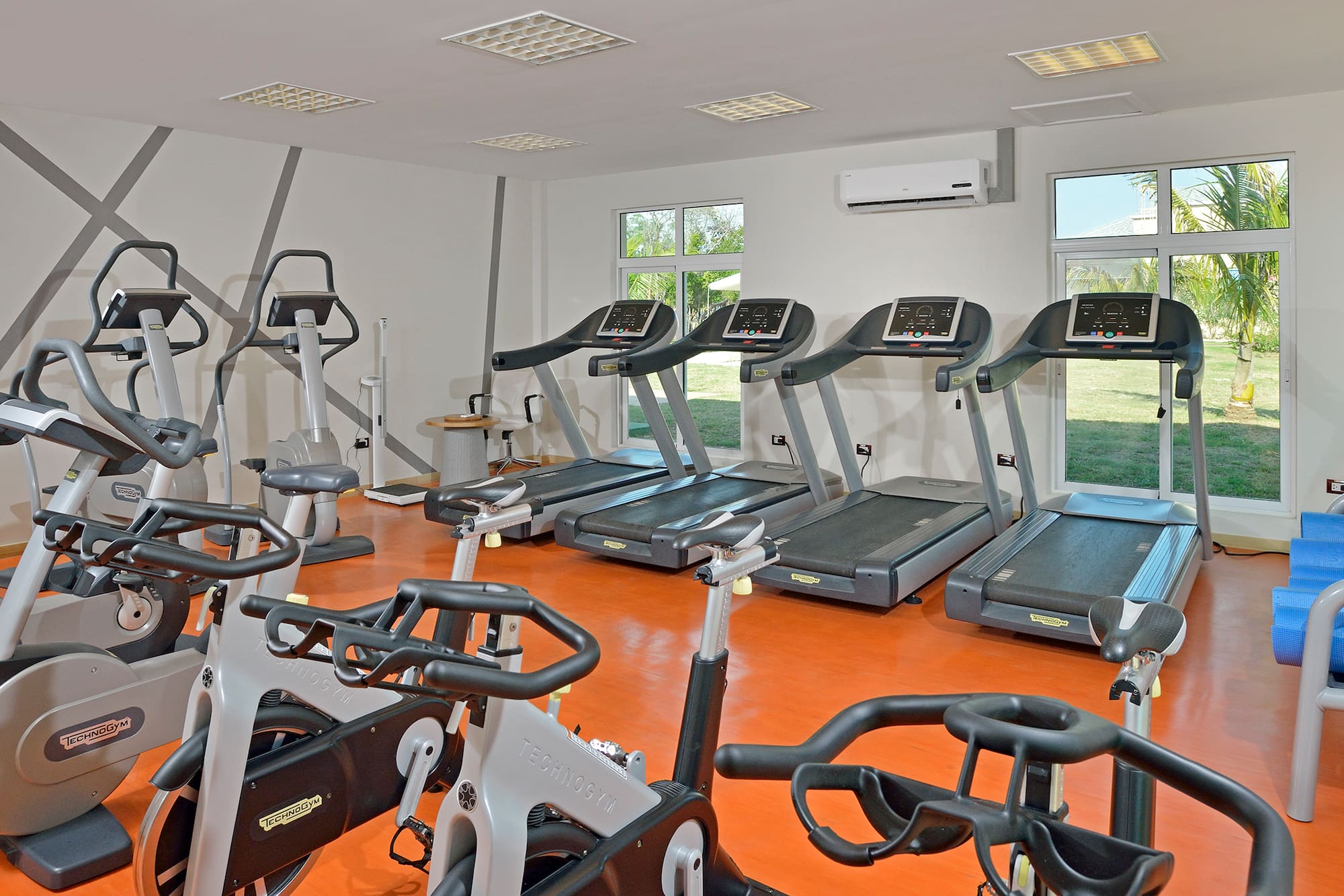 a room with treadmills and exercise machines
