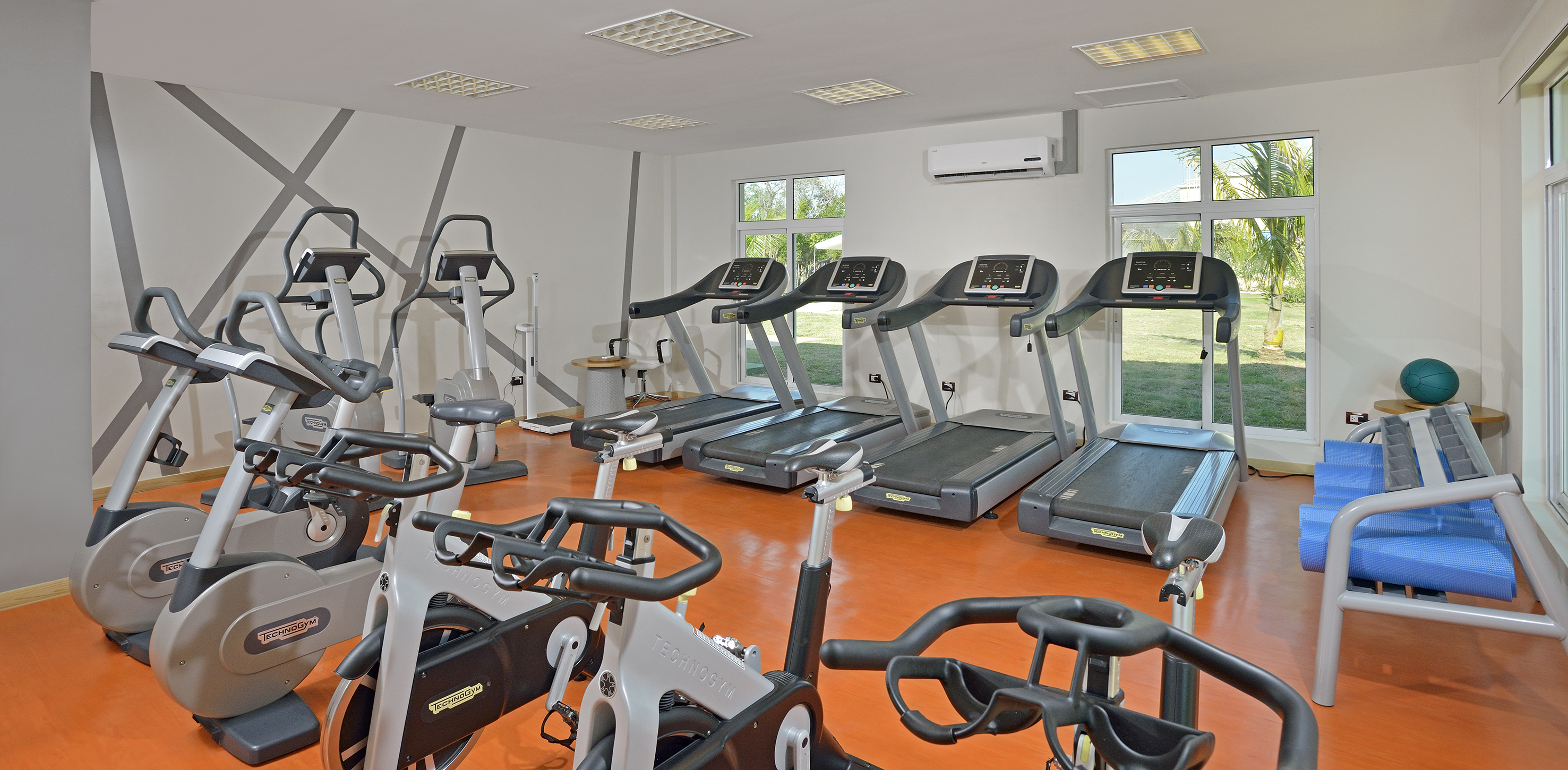 a room with treadmills and exercise machines