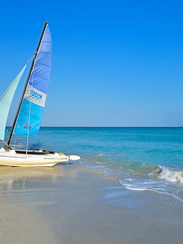 a sailboat on a beach