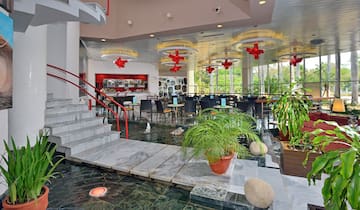 a flooded restaurant with a staircase and a staircase