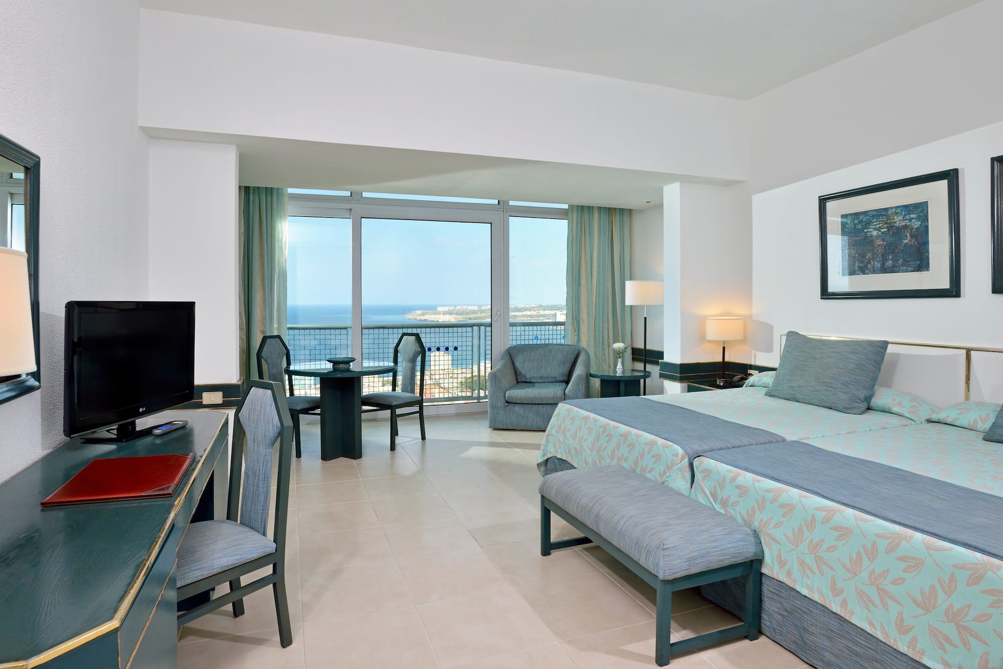 a room with a television and a bed