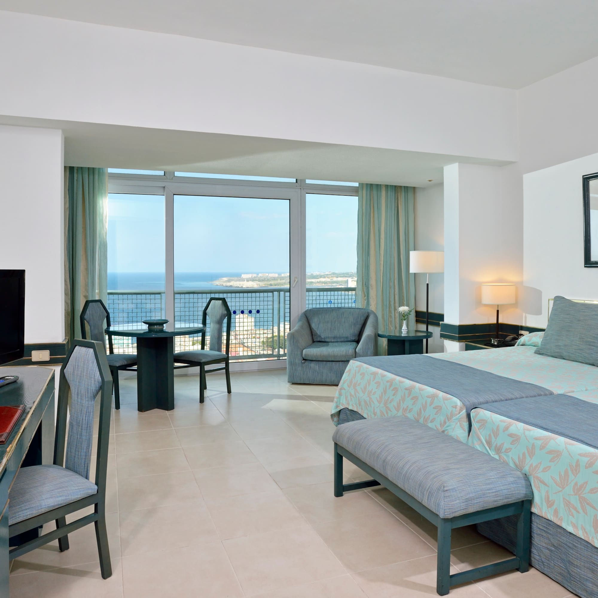 a room with a television and a bed