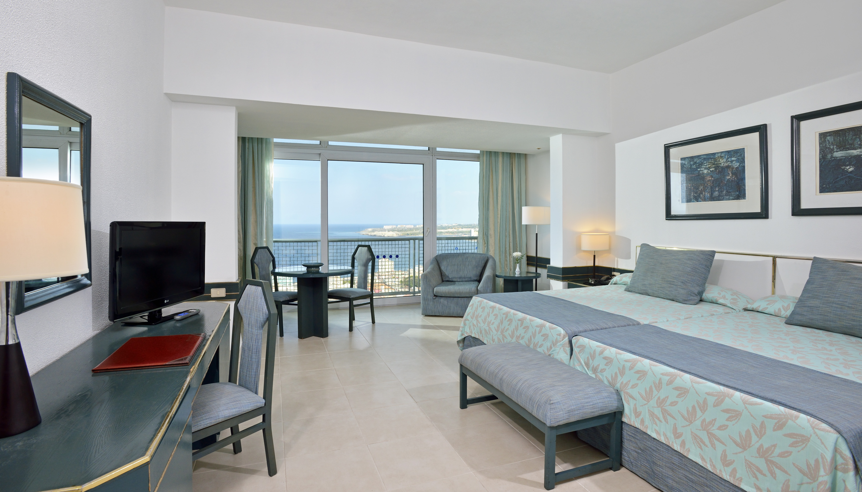 a room with a television and a bed